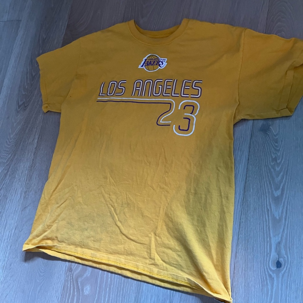 Vintage yellow LeBron james lakers T shirt with a retro jersey design no flaws